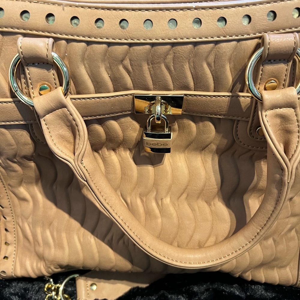 Bebe bag in tan/gold with chain strap. Barely carried in perfect condition.